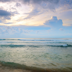 Ocean and sunset on the dark sky