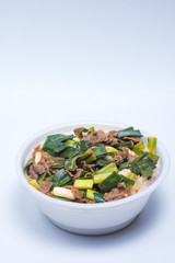 White rice with green vegetables and meat