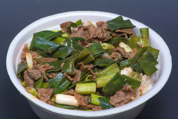 White rice with green vegetables and meat