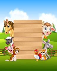 Cartoon farm animals holding wooden sign