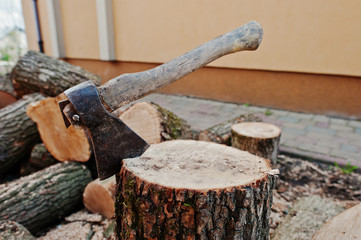 Axe in stump background chopped firewood.