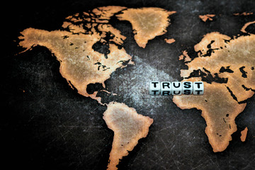 TRUST on grunge world map