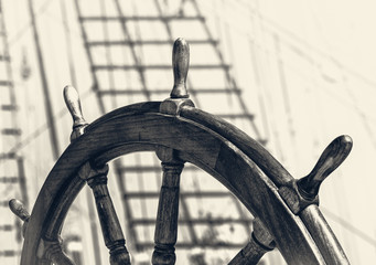 Steering wheel of old sailing vessel in retro style. © Repina Valeriya