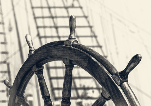 Steering wheel of old sailing vessel in retro style.