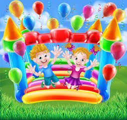 Fototapeta na wymiar Kids Jumping on Bouncy Castle