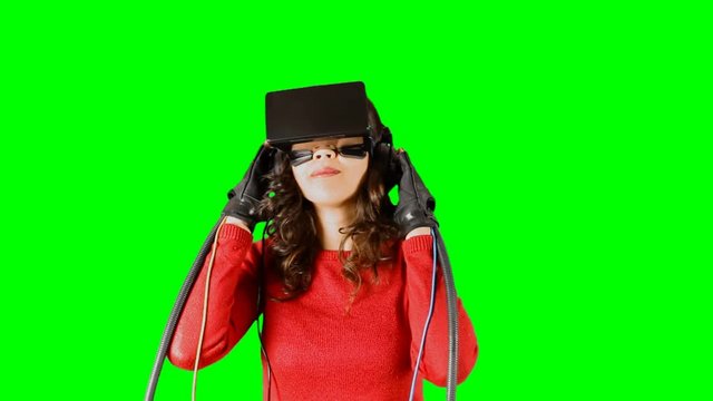 A slow-dancing girl, wearing a virtual reality headset and wired gloves. Pre-keyed chroma-key shot.