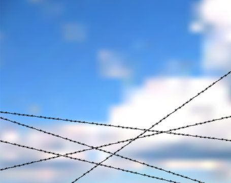 Barbed wire against blue sky. Protection or security vector concept. Sky bounded by barbed wire. The lack of freedom behind barbed wire. Metallic fence for barrier or property protection against sky