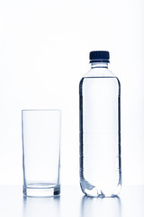 Bottle of water and glass