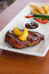 Grilled steak with french fries and vegetables