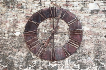 Old rusty clock on the wall, Zagreb Kaptol, Croatia