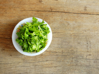 fresh coriander on a wooden table