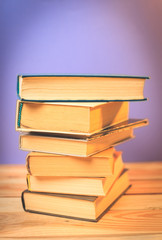 Vintage old books on wooden deck table
