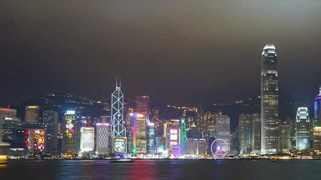 Light show in Hong Kong at night. Victoria Harbour and Hong Kong Central. Pan timelapse
