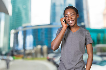 Portrait of african man talking on the phone isolated