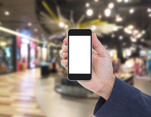 Hand holding blank screen mobile phone with blur shopping mall b