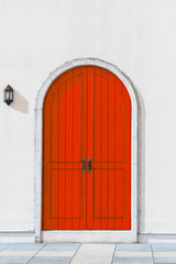 Colorful wooden red door and Detail of house exterior