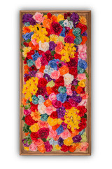 Beautiful multicolored artificial flowers in wooden frame isolat