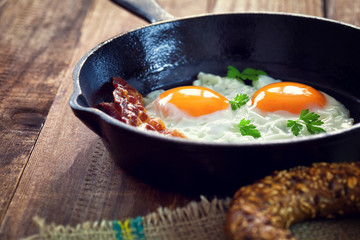 Bacon and Eggs for breakfast in iron skillet