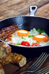 Tasty breakfast with fried eggs and bacon