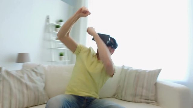 man in virtual reality headset playing game