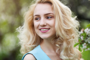 close-up portrait of a young sexy girl hipster beautiful blonde with red lips laughing