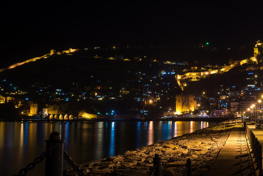 Night view of harbour, fortress and ancient shipyard in Alanya, Turkey.