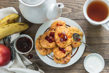 Banana cheese scones for Breakfast with jam,sour cream.Tea, fruit.