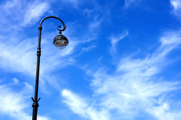 street lamppost against the blue sky