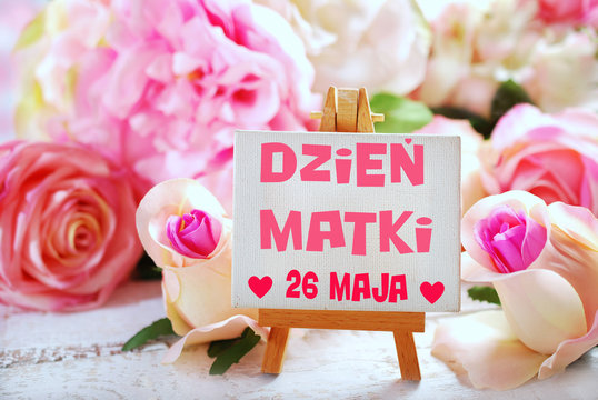 small easel with text for mothers day written in polish