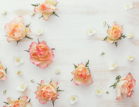  Roses and jasmine natural flower background. Various soft roses and and jasmine flowers scattered on a vintage background, overhead view, vintage toned image