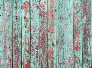 Old green crackle paint on the wooden background.