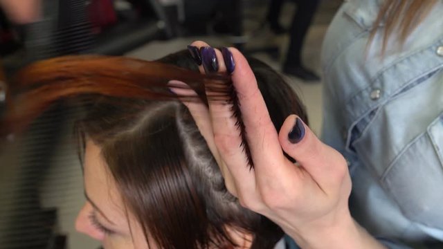 Stylist cutting hair tips