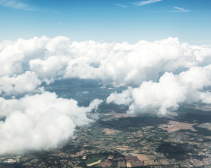 Aerial view of clouds and landscape under them. © volff