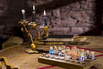 burning candles in a candlestick on a table