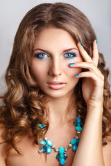Obraz premium Blue beauty fashion make-up.Beautiful young model with bright make-up and manicure
