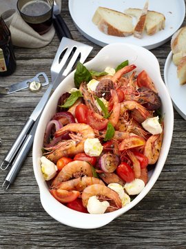 High angle view of prawn caprese salad in serving dish