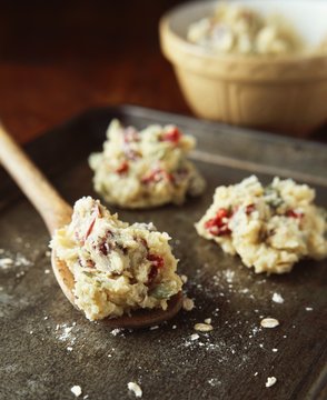 Scoops of cookie dough on baking tray