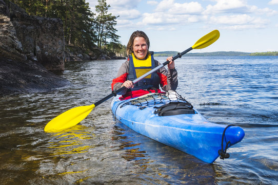 Mature woman kayaking