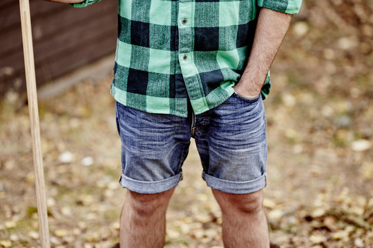 Man in denim shorts, mid section