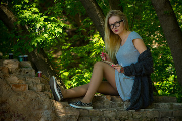 Young pretty woman paintig outdoor