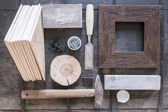 Overhead view of frame, chisel, hammer and wood parts
