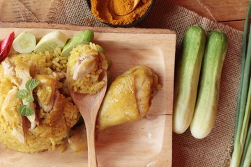 Chicken biryani with rice delicious and sauce.