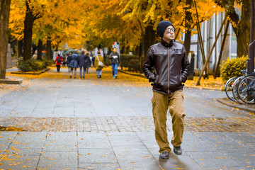 Fototapeta premium An Asian Man in a Brown Jacket