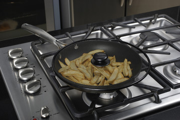 frying potatoes in the pan