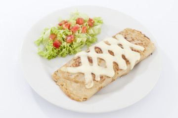 Delicious burrito brunch of sausage  on white plate