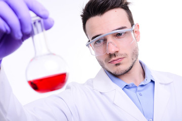 handsome young chemical biologist working in a laboratory