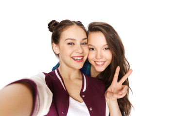 happy friends taking selfie and showing peace