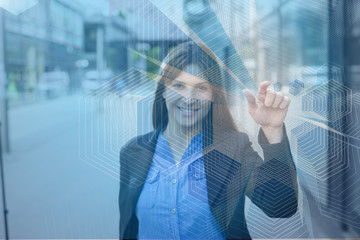 Pretty businesswoman shows the finger at the camera and clicking on the virtual button. The face is out of focus while her finger in focus.