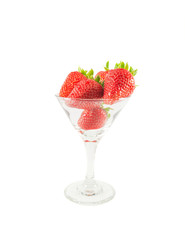 Strawberries in a glass on a white background