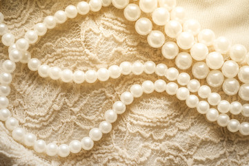 Pearl necklace on lace clothes